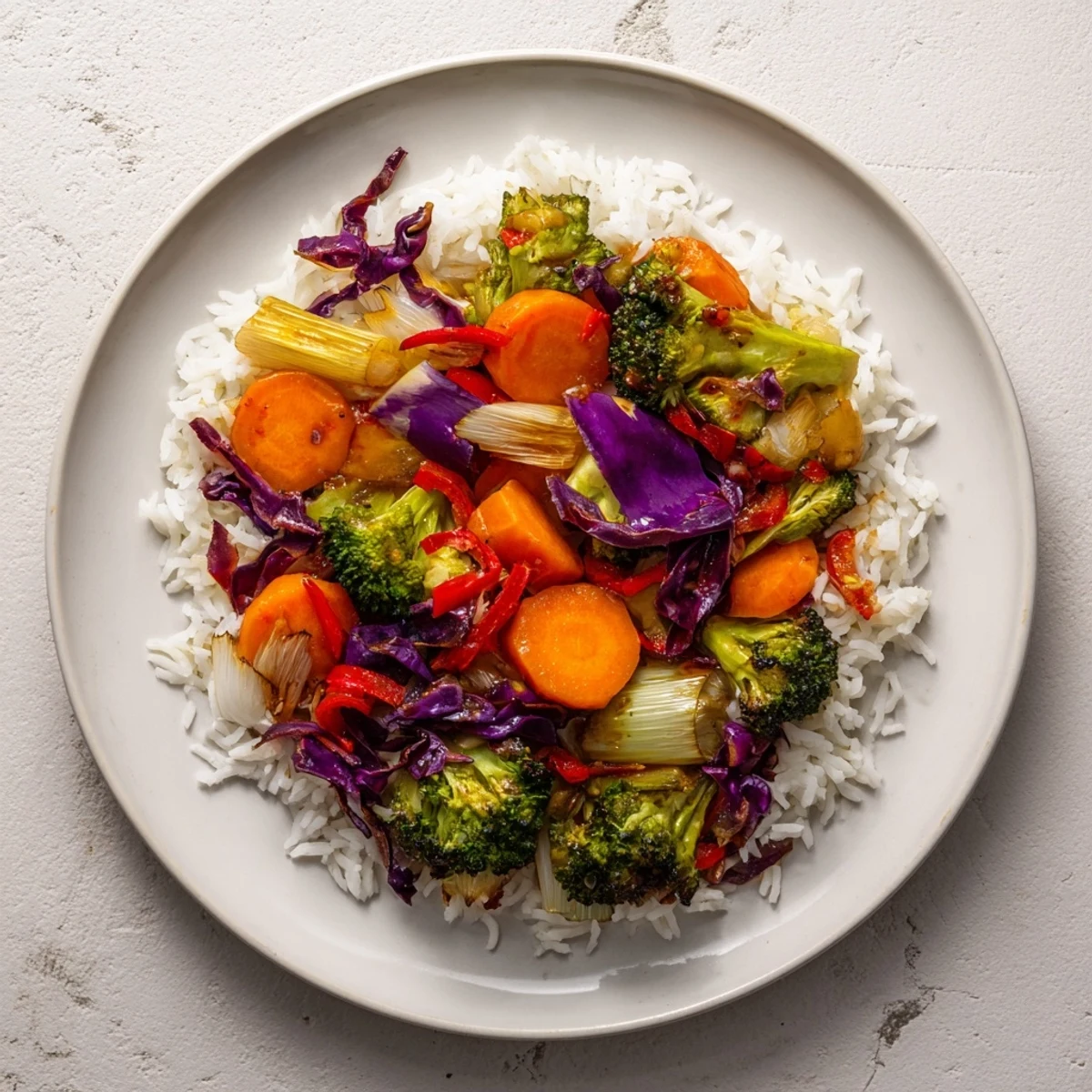 Quick Winter Vegetable Stir-Fry with Rice: Colorful medley of crisp vegetables in a delicious sauce atop fluffy rice.