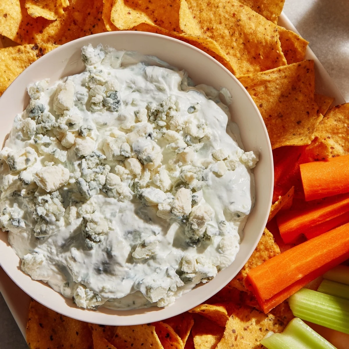 Frozen Pond Blue Dip Platter with vibrant veggies and crisp chips, ready to serve.