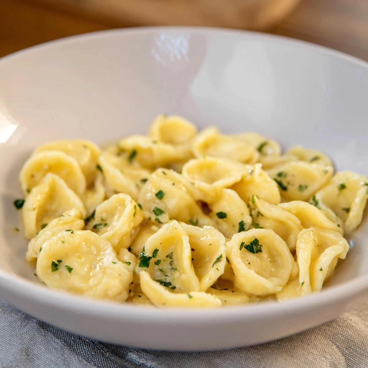 Fluffy spaetzle noodles, golden from a skillet, ready to be served as a warm side dish.