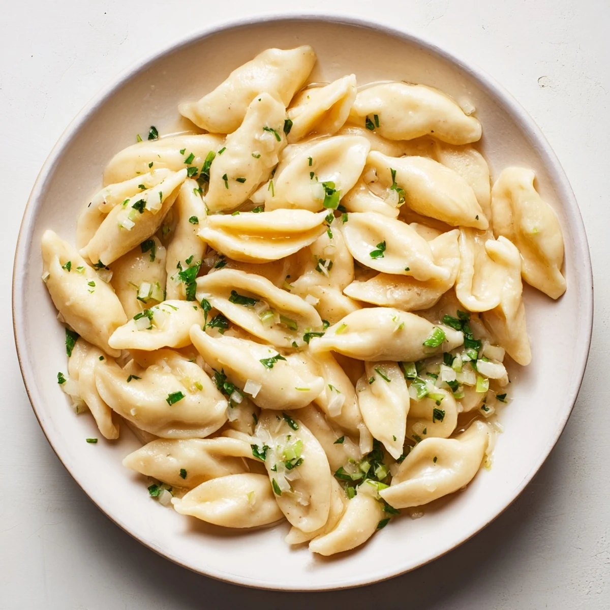 Close-up of homemade spaetzle: tender, pillowy pasta, great with gravy or melted cheese.