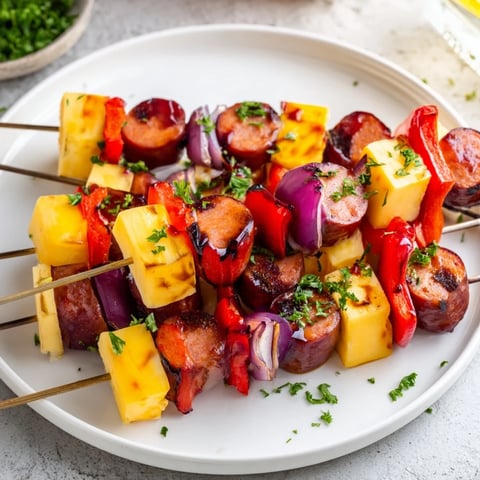 Savory Skewers showcasing grilled Chimney Stack Sausage and Cheese with colorful bell peppers and onions.