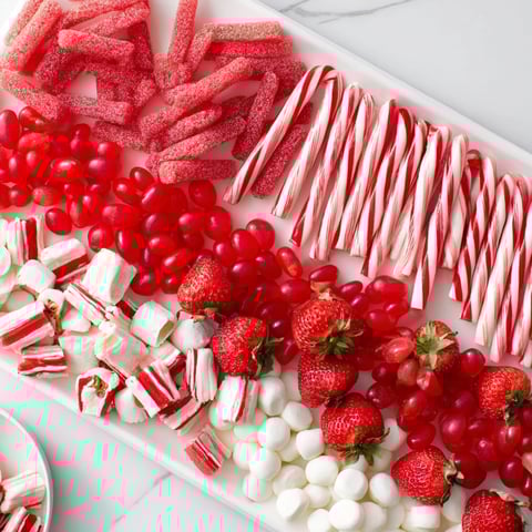 Festive sweet board: a vibrant array of red and white striped candies and treats for sharing.