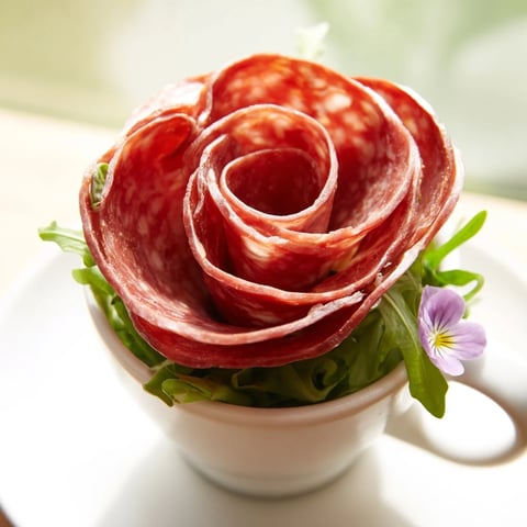 Victorian Tea Rose appetizer, savory salami and pepperoni roses nestled in porcelain teacups, ready to serve.