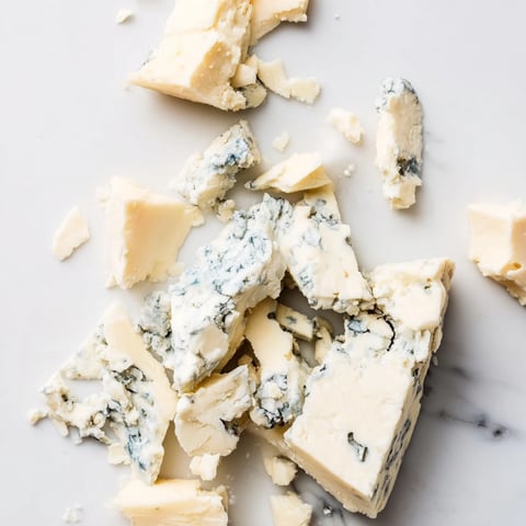 "The Marble Quarry cheese board on a cool marble slab, perfect for a striking appetizer or snack."