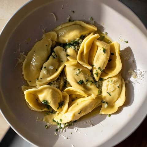 A bowl of fresh spaetzle, perfect German egg noodles lightly browned and tossed in butter.