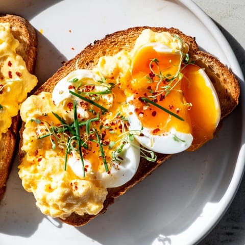 A close-up of a delightful Egg Flight Toast with three flavorful egg preparations on toasted bread.