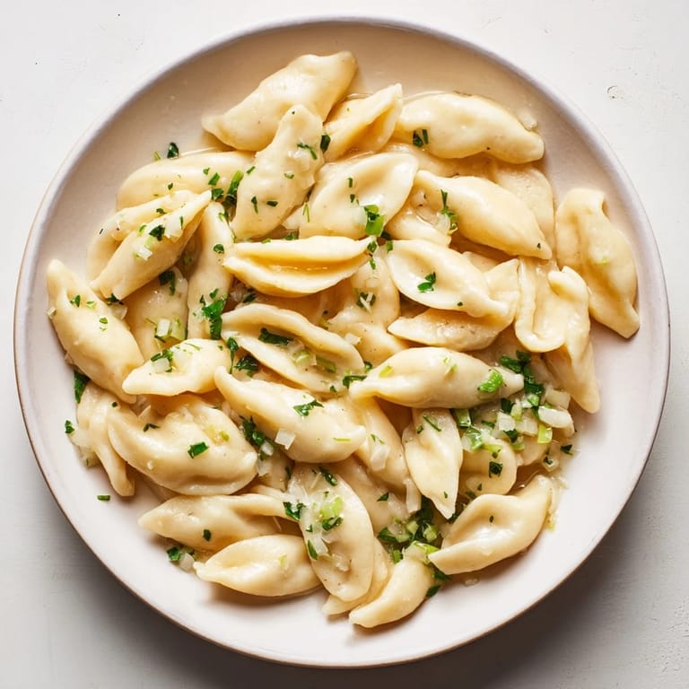 Close-up of homemade spaetzle: tender, pillowy pasta, great with gravy or melted cheese.